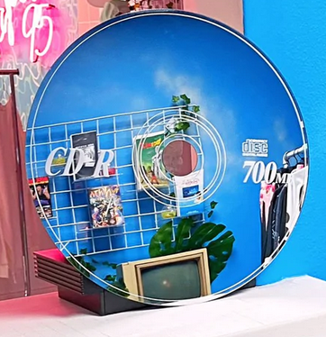 CD shaped mirror in vaporwave themed room