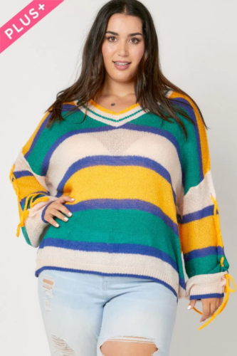 Plus size Mardi Gras sweater with green, white, yellow, and purple stripes, paired with light wash ripped jeans