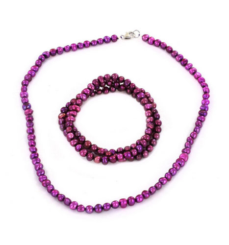 beaded jewelry set in metallic purple with a necklace and multi layer bracelet