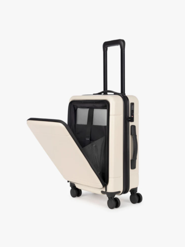 Calpak beige carry-on with pop out laptop pocket