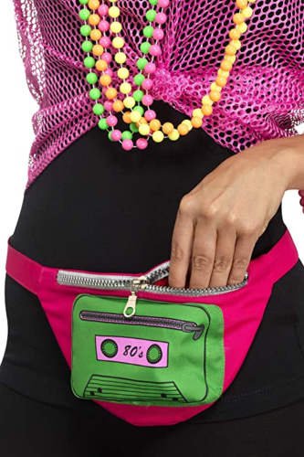 hot pink fanny pack with a green cassette that says '80s', featured on a model in a 1980s costume