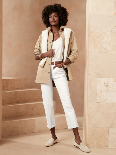 Business casual outfit: White jeans, cream loafers, beige utility jacket, belt, cream cami