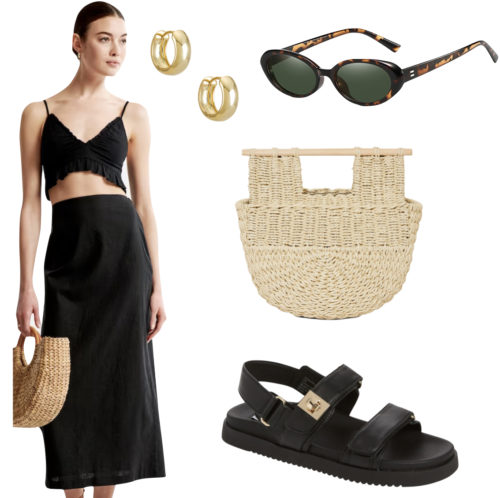 Summer vacation outfit with a black maxi skirt, crop top, straw handbag, sunglasses, and sandals
