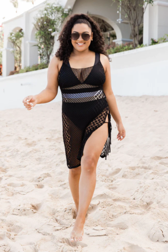 Edgy beach outfit with black bikini and black woven mini dress