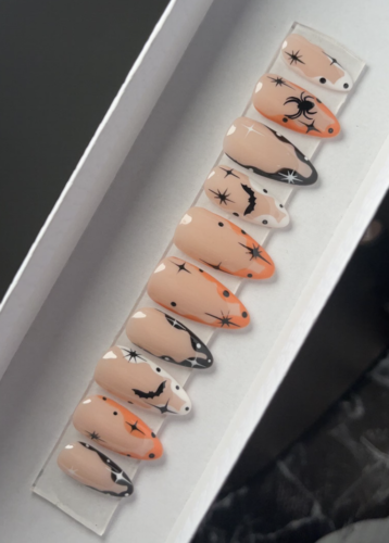 Orange black & white Halloween nails from Etsy