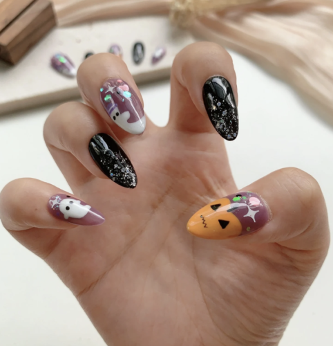 Cute Halloween pumpkin nails from Etsy