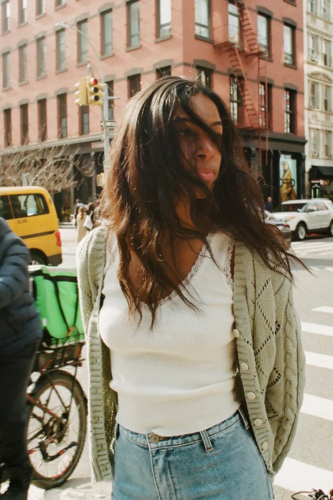 Cream lace tank top, green cardigan, denim mini skirt outfit