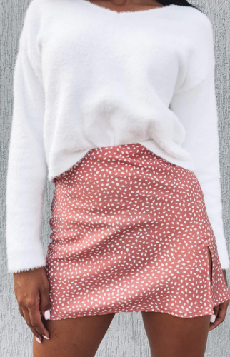 Soft girl outfit with white fuzzy sweater and pink and white printed mini skirt