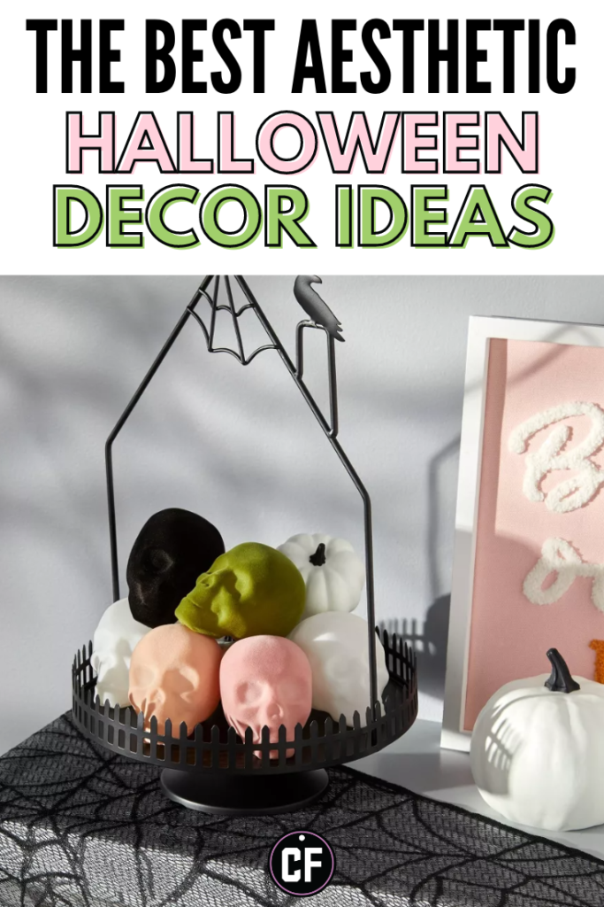 Graphic with a photo of green, white, peach, pink, and black faux skulls in a black basket placed on a decorated mantle with the text The Best Aesthetic Halloween Decor Ideas