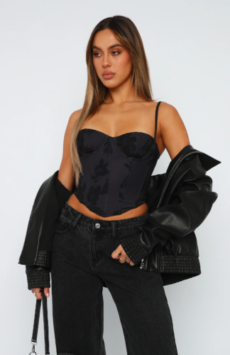 All black corset top outfit with black corset top, faux leather jacket, black jeans, black mini purse