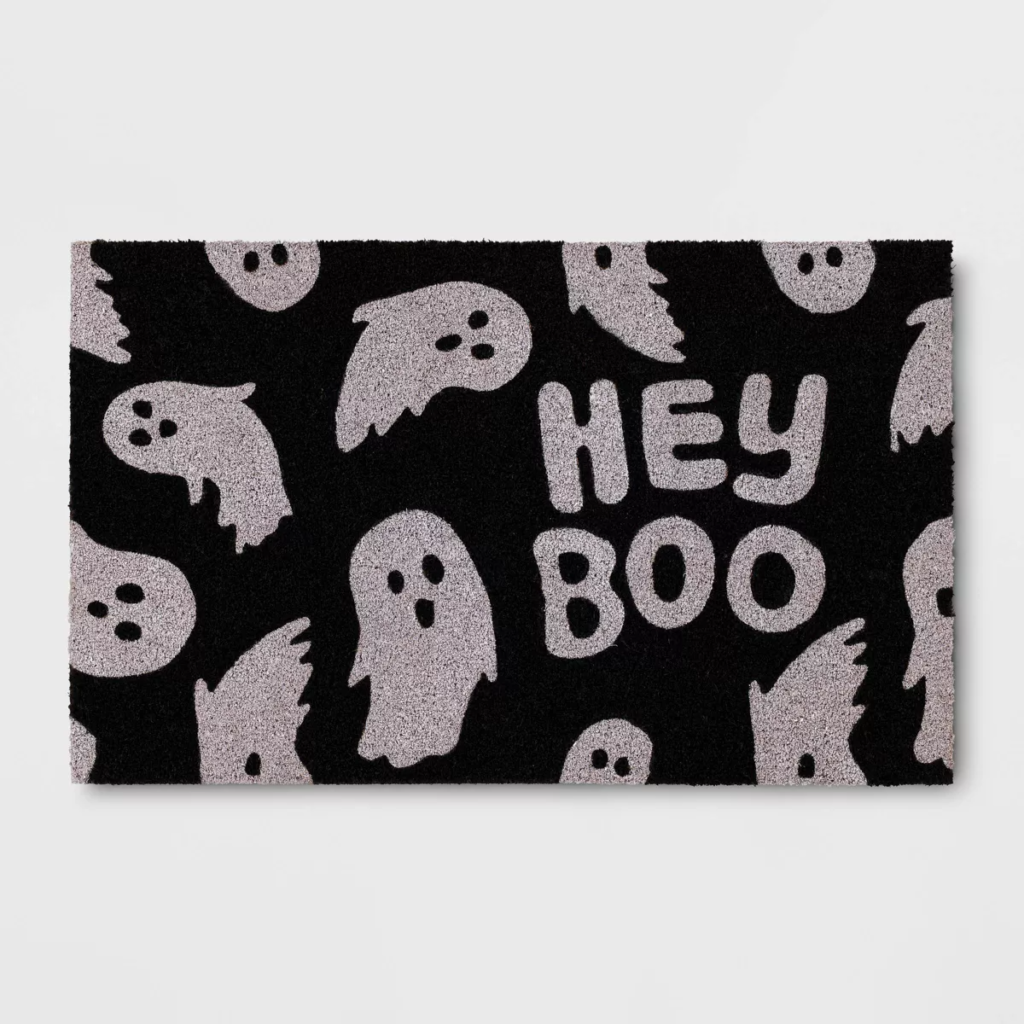 Black and white ghost graphic doormat that reads 