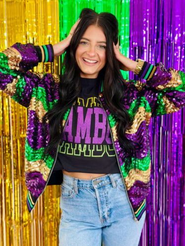 Mardi Gras sequin jacket outfit with light wash jeans and a Mardi Gras crop top