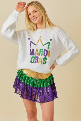 Sparkly ruffled mardi gras mini skirt paired with a glitter sweater