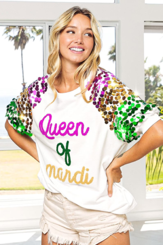 White tee that reads Queen of Mardi in script letters, with sleeves embellished in purple, gold, and green sequins