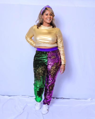 Plus size Mardi Gras outfit with sequin joggers and gold lame crop top, paired with sneakers