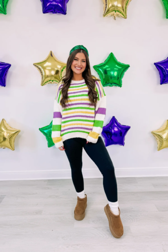 Mardi Gras outfit with striped sweater, green metallic headband, black leggings, socks, and uggs