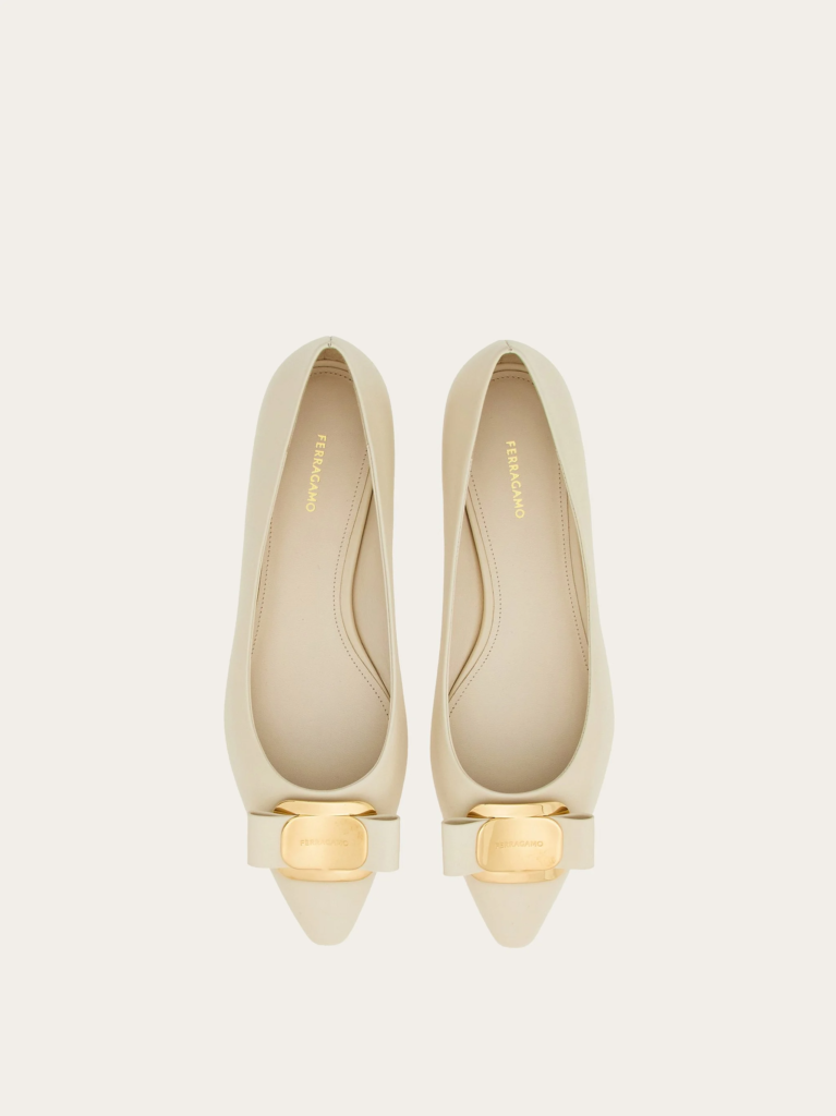 Ferragamo ballet flats in cream with gold hardware on the toe