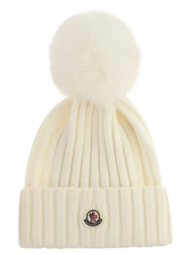 Cream colored Moncler beanie from Cettire